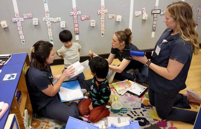Student clinicians interact with Luiz, 4, during free play time on Thursday, March 5 at the Callier Center in Dallas.  The Callier Center offers many different programs for children with communication disorders.